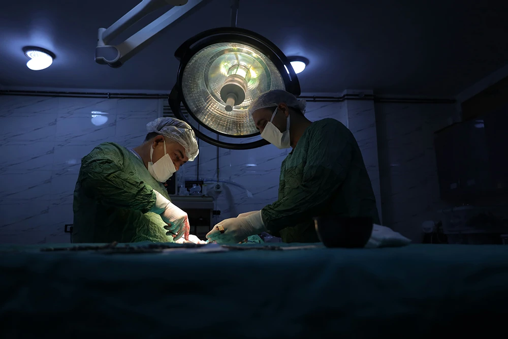 Orthopedic surgeons performing shoulder surgery as part of advanced treatment options for shoulder dislocation